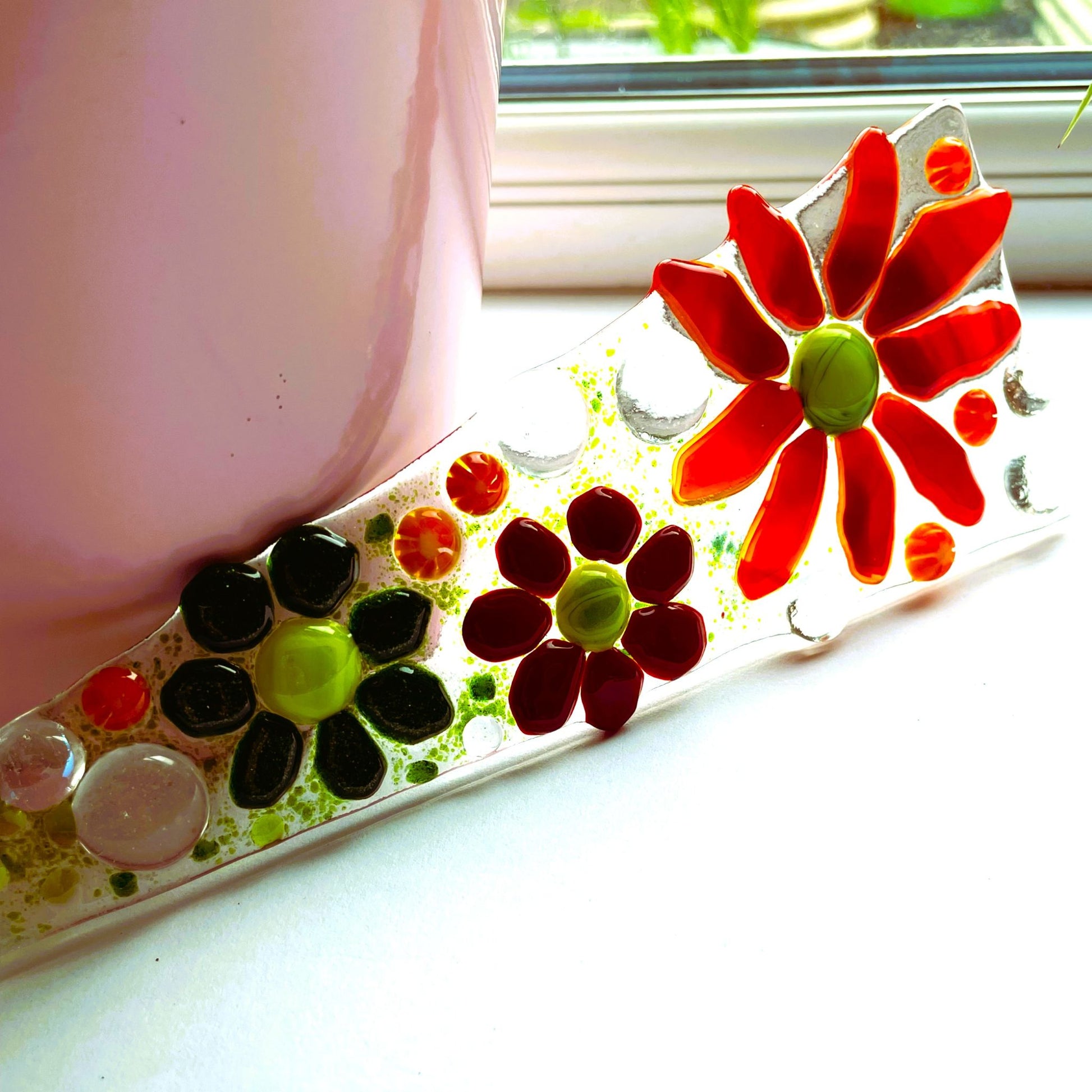 Red glass flower plant stake detail shot