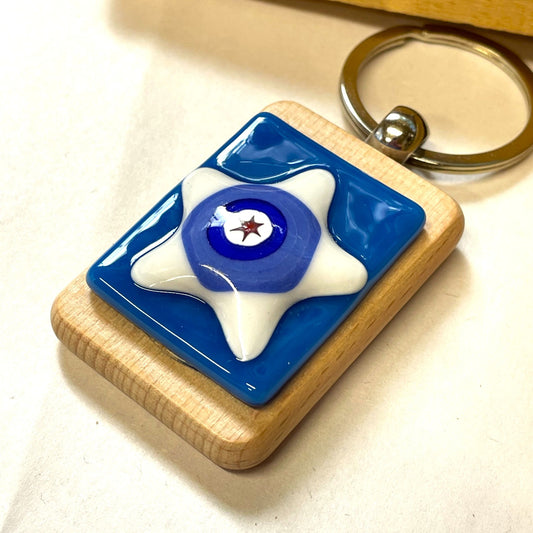 Back of a handmade wooden keyring showing the keyring loop