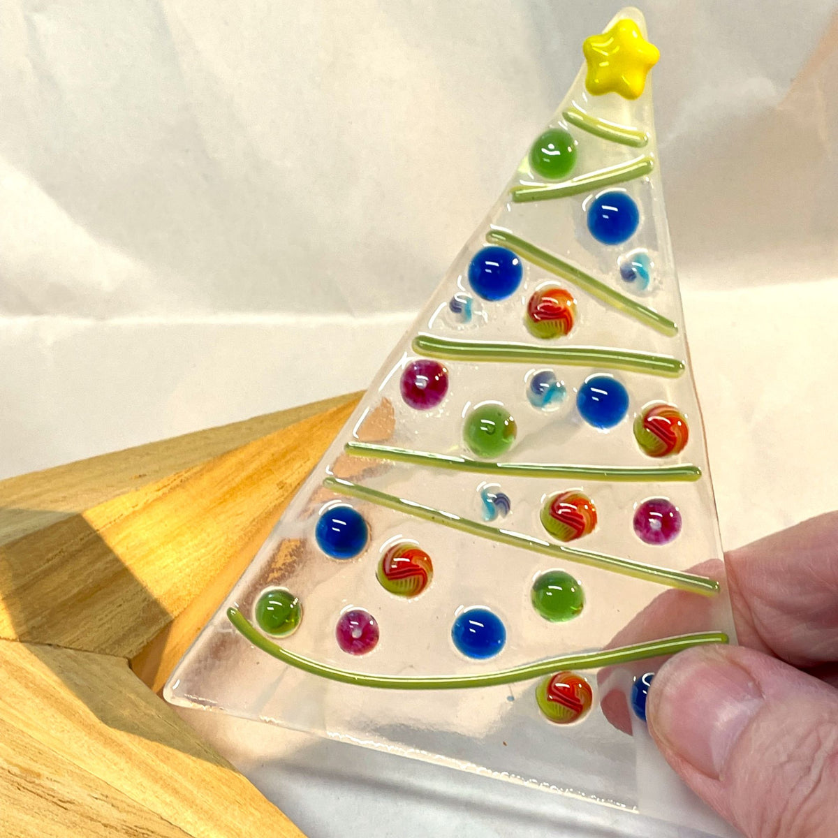 Handmade fused-glass Christmas tree with yellow star and colourful glass decorations